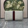 Pouch GG Marmont con cinturino GUCCI