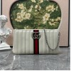 Pouch GG Marmont con cinturino GUCCI