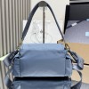Borsa Prada Explore medium in Re-Nylon con pattina PRADA