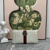 Pouch GG Marmont con cinturino GUCCI